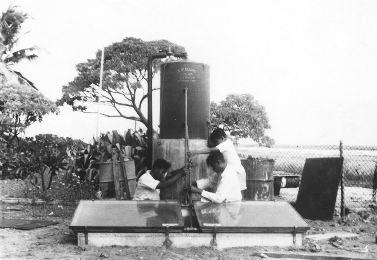 People installing mounted copper tank